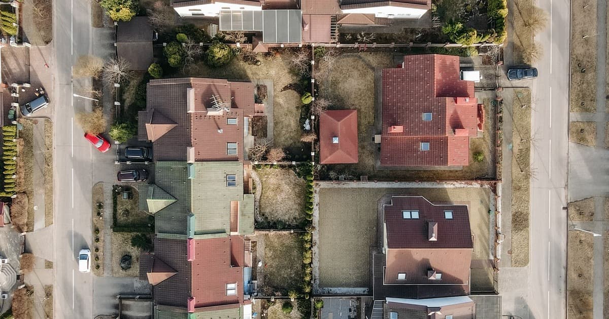 Aerial view of a planned residential neighborhood with plotted streets and houses