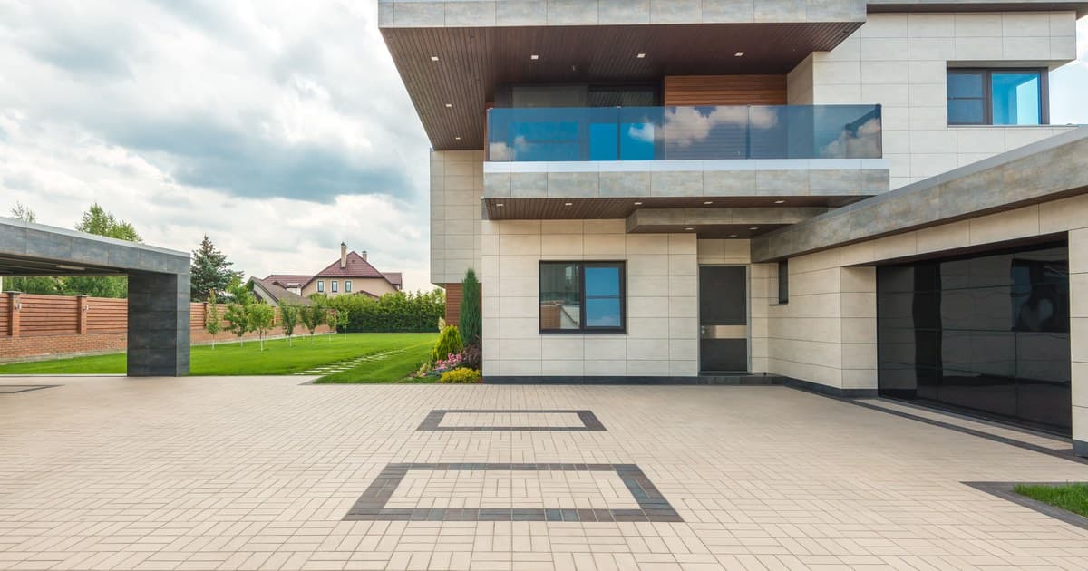 Modern villa with a wide street-facing frontage and lawn