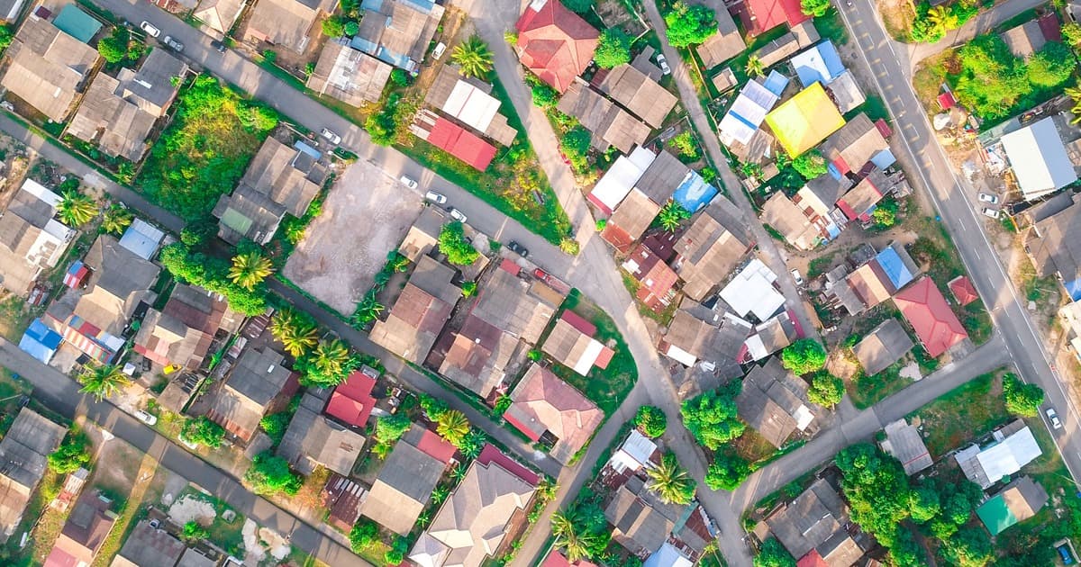 Aerial view of a planned residential neighborhood with houses, roads and green plots