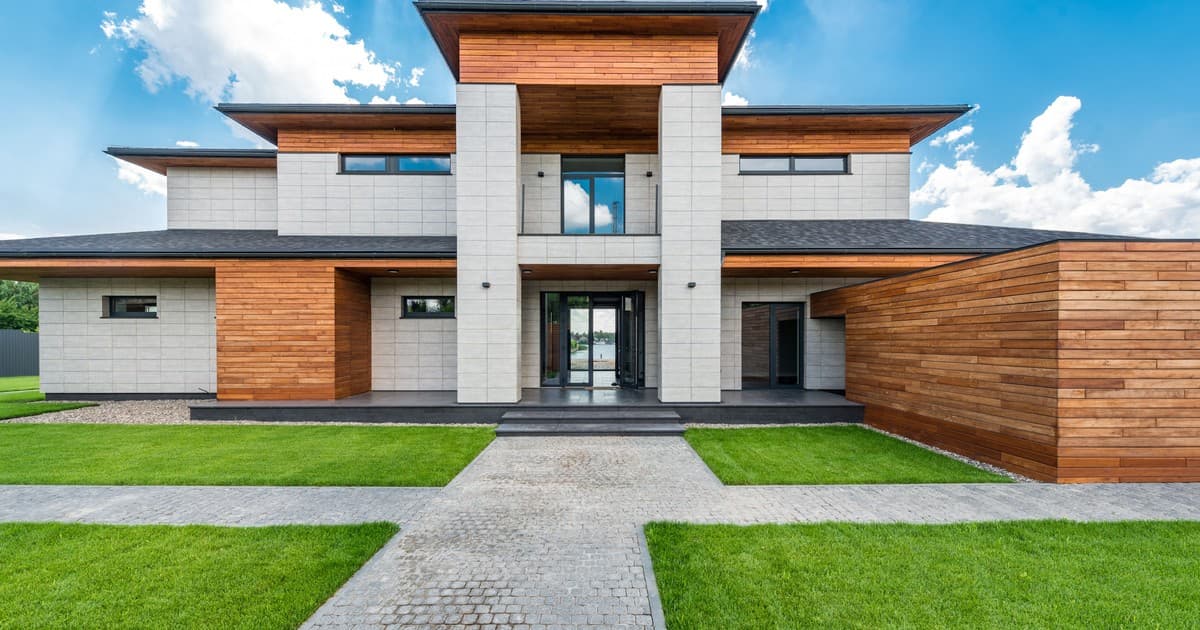 Modern villa with manicured lawn in a Lahore housing society