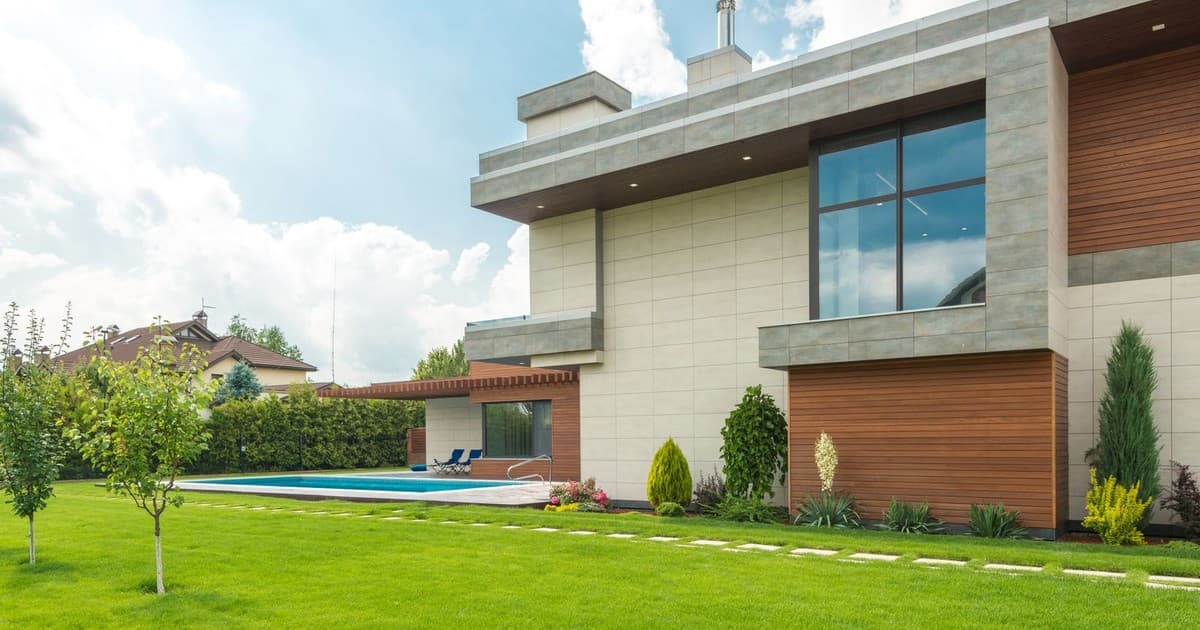 Modern house with a large green lawn in a Lahore residential society