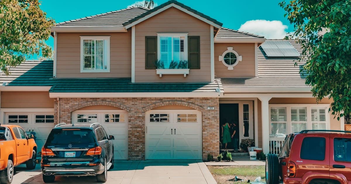 A suburban house with a driveway, the kind of property a buyer should verify before paying